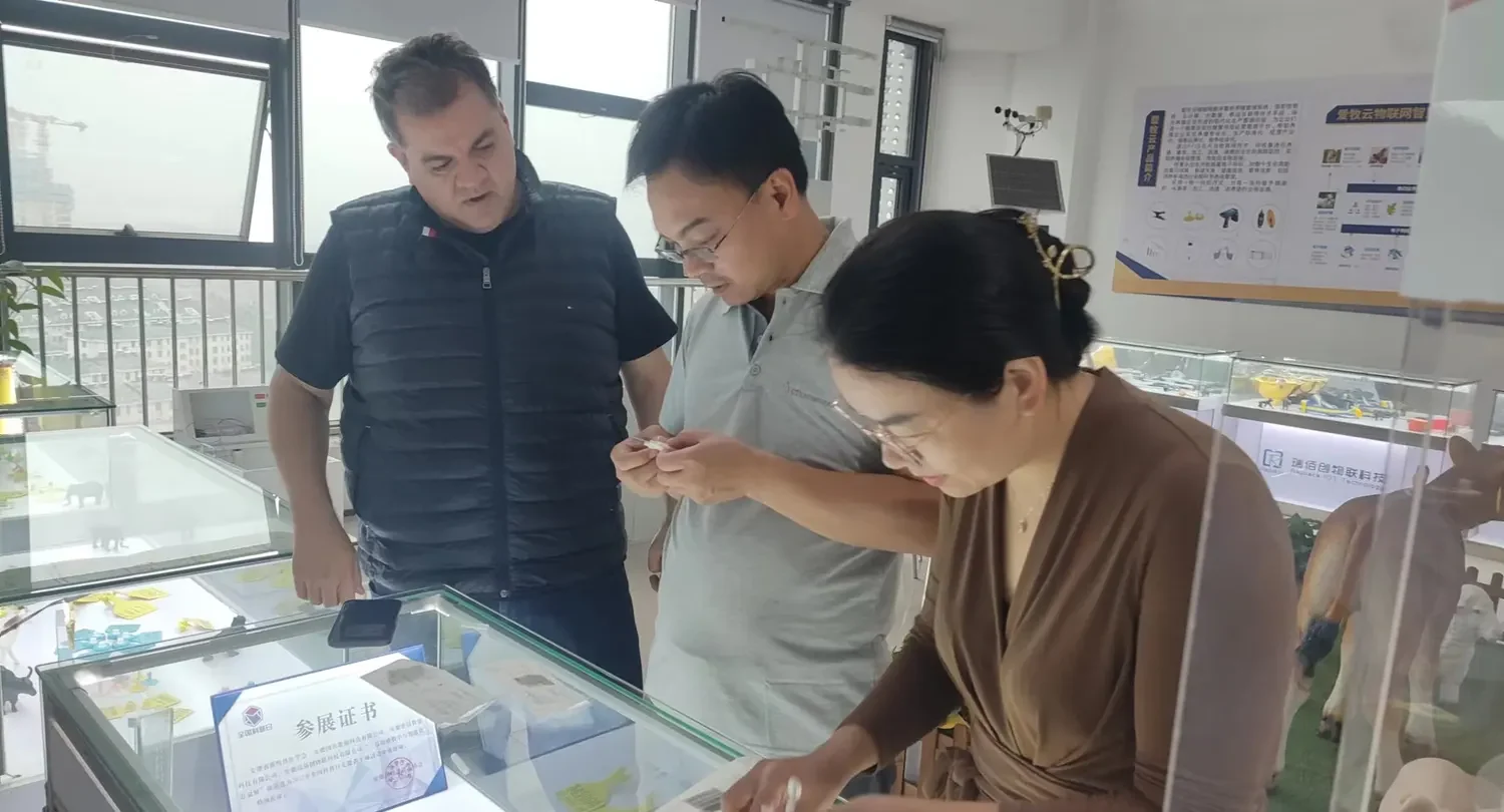 Visiting buyers handle the tags and readers in the sample room before deciding on a frequency and a